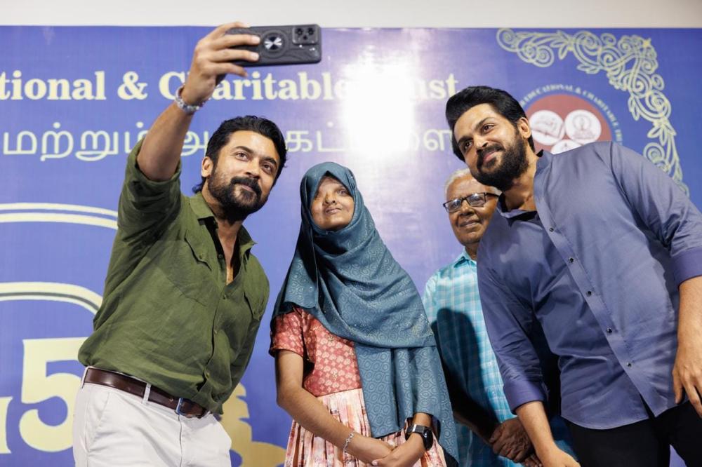 agaram-trust-actor-sivakumar-surya-karthi-photos